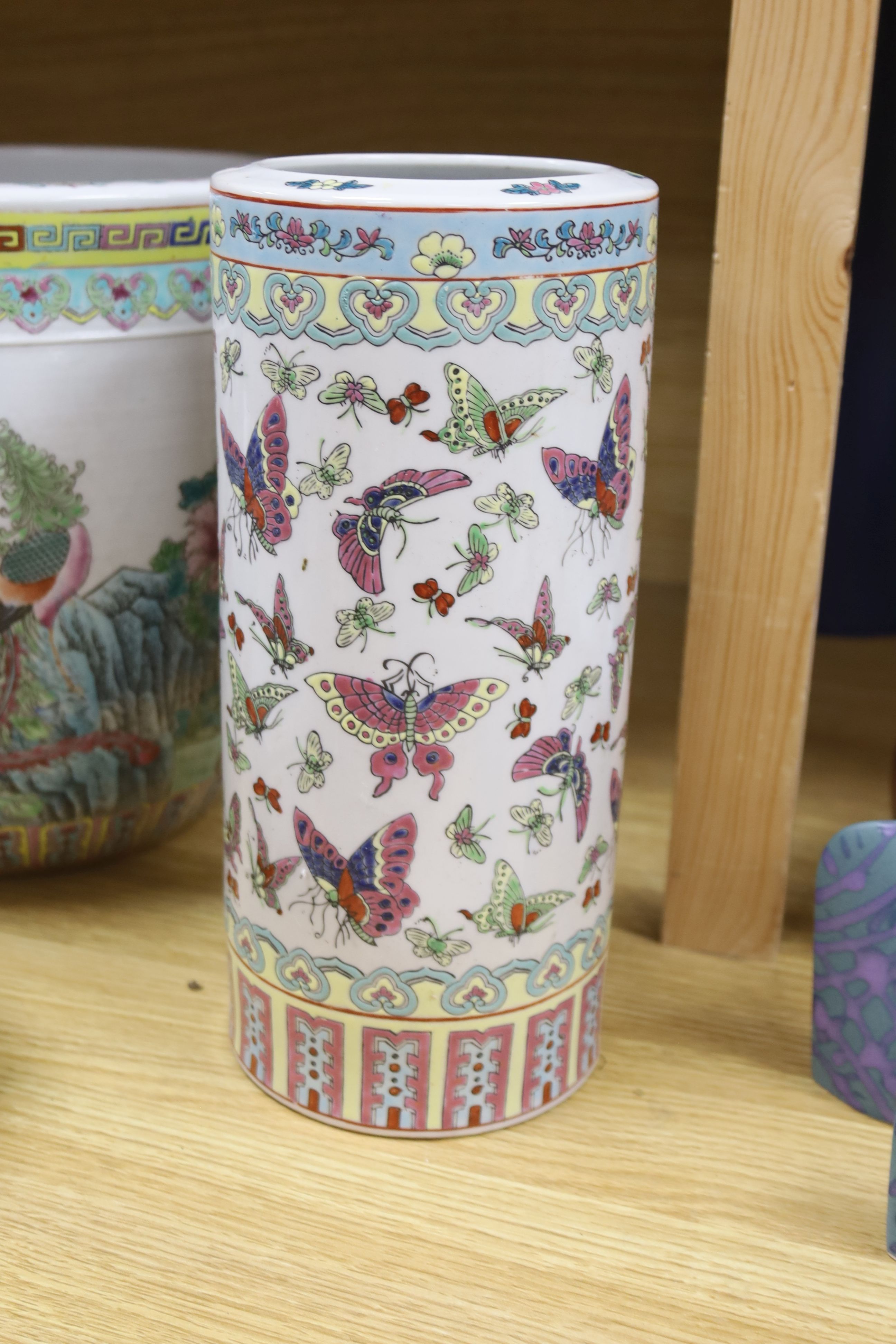 A Chinese famille rose jardiniere, a late 19th century famille rose narcissus pot, a cylindrical vase and a famille verte jar and cover, tallest 28.5cm